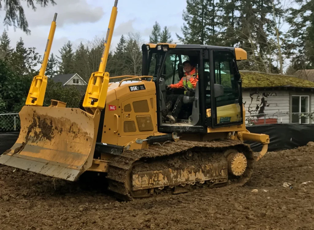 person maneuvering bulldozer to grade land lake stevens wa